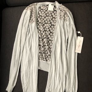 Grey with flowers in the back cardigan